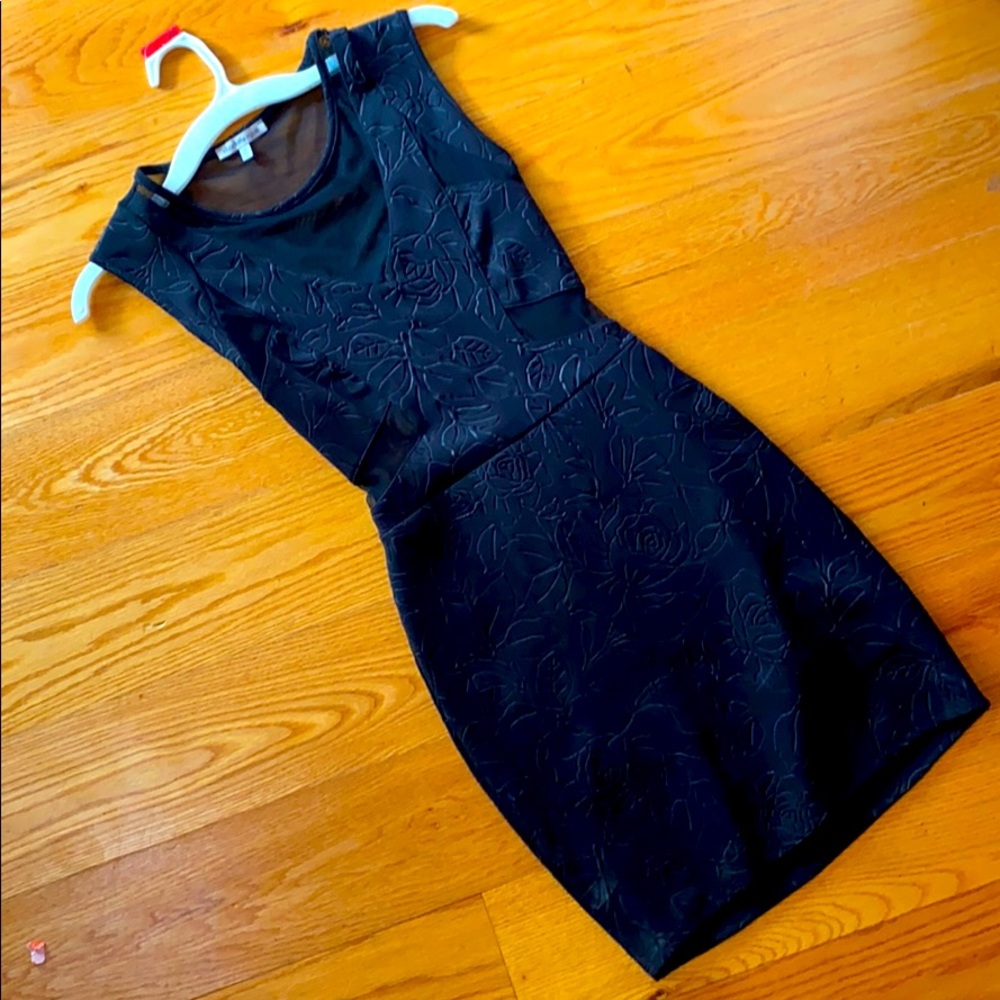 A black formal, tight fitting dress